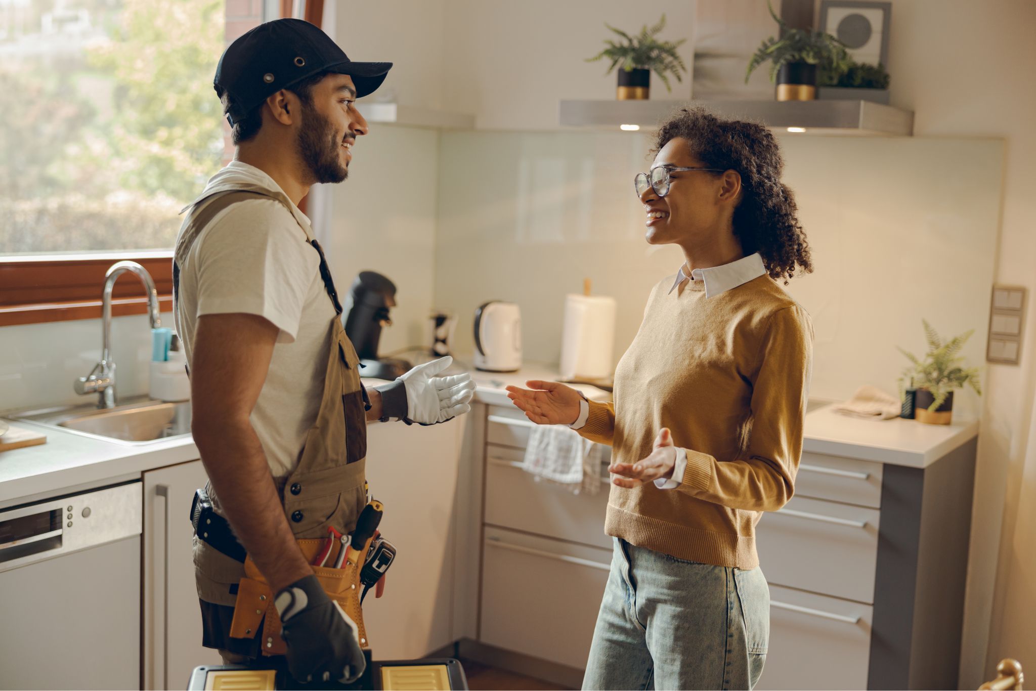 Professional plumber servicing a modern home